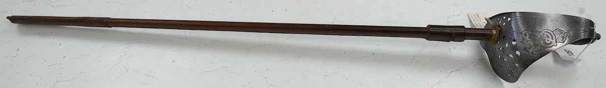 An 1898 pattern British NCO’s sword with leather scabbard, Edward VII cipher to guard, the blade with government stamps, issued 1903, blade 82cm. Condition - fair, some wear overall